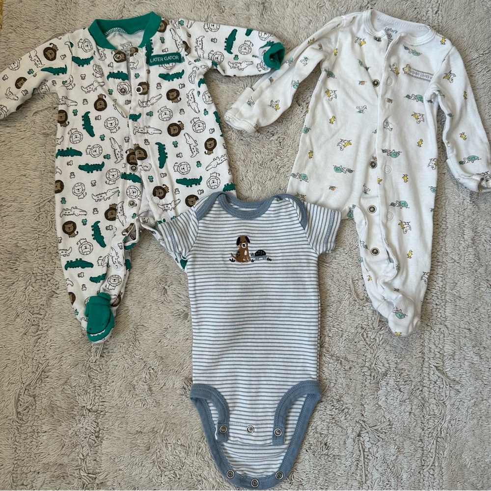 Assorted Newborn footies and onesie - Carter’s